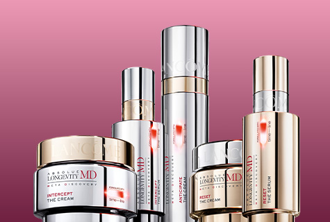 Lancôme Absolute Longevity MD Hautpflege-Serie: Cremes und Seren vor pinkem Hintergrund